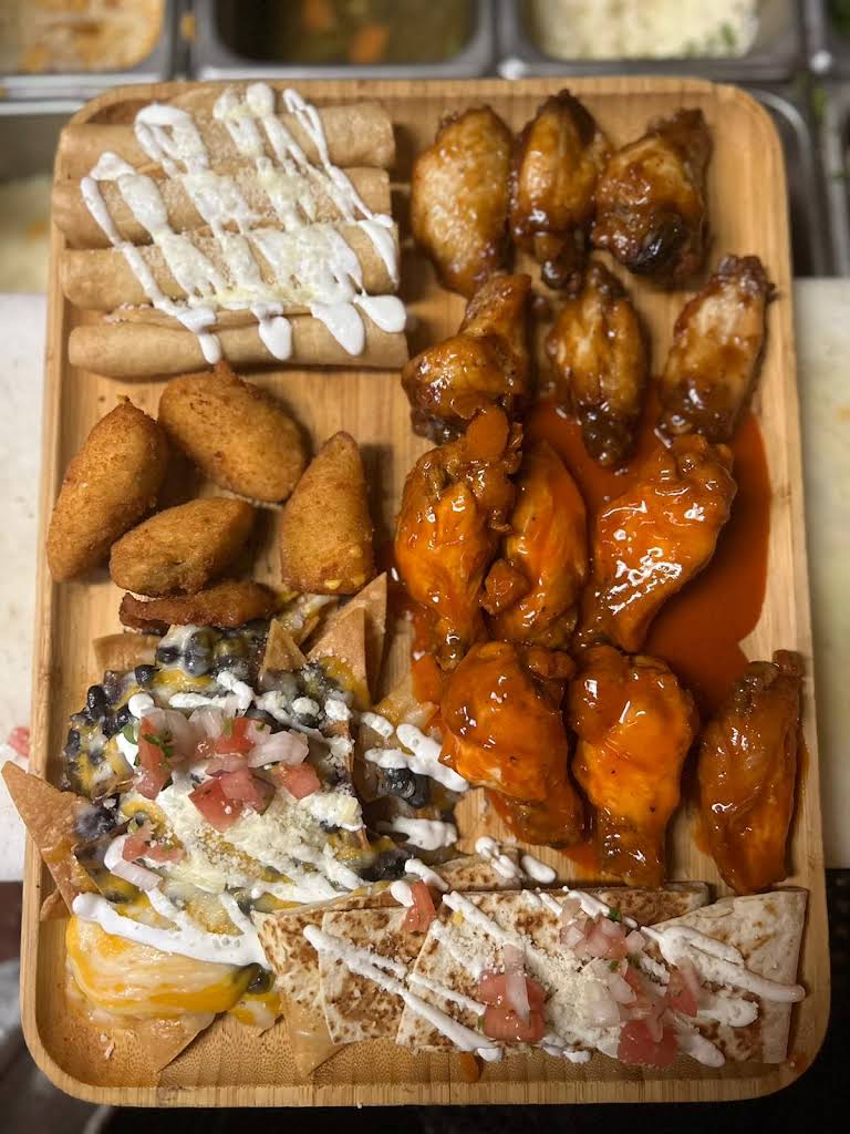 Mexican restaurant platter with chicken wings, and other traditional Mexican food