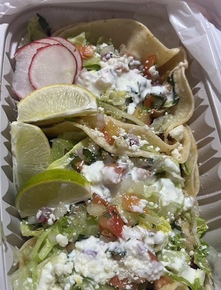 Closeup shot of plate with tacos and limes