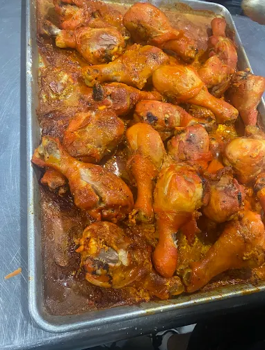platter with cooked chicken drumsticks